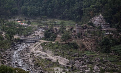 A damaged village seen from the Araniko Highway after the earthquake in Nepal last May. Landslides during the monsoon season could bring more devastation.