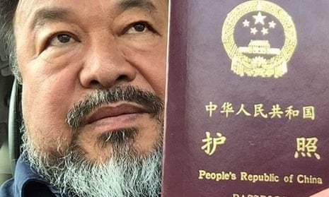 Ai Weiwei's with his recently returned passport.