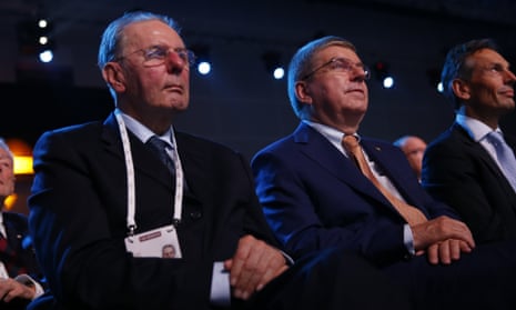 Honorary President of the IOC Jacques Rogge, left, sits with IOC President Thomas Bach