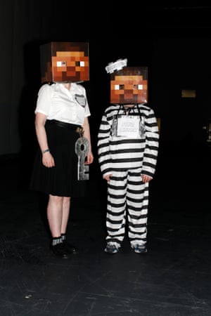 Emily Kaneen and Toby Pazzar, 12, dressed as mine cop and mine convict. Toby is teaching his mum how to play Minecraft