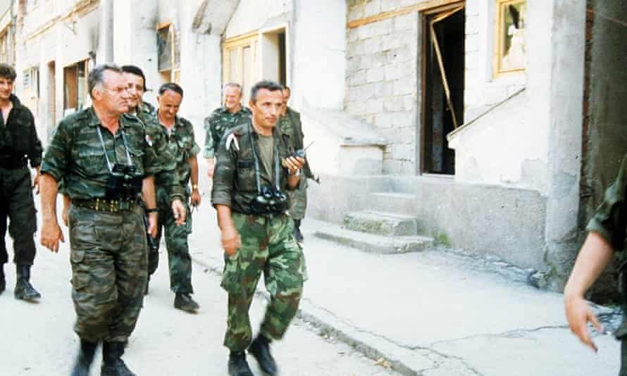 Commander general Ratko Mladic with troops as Bosnian Serbs enter Srebrenica in 1995