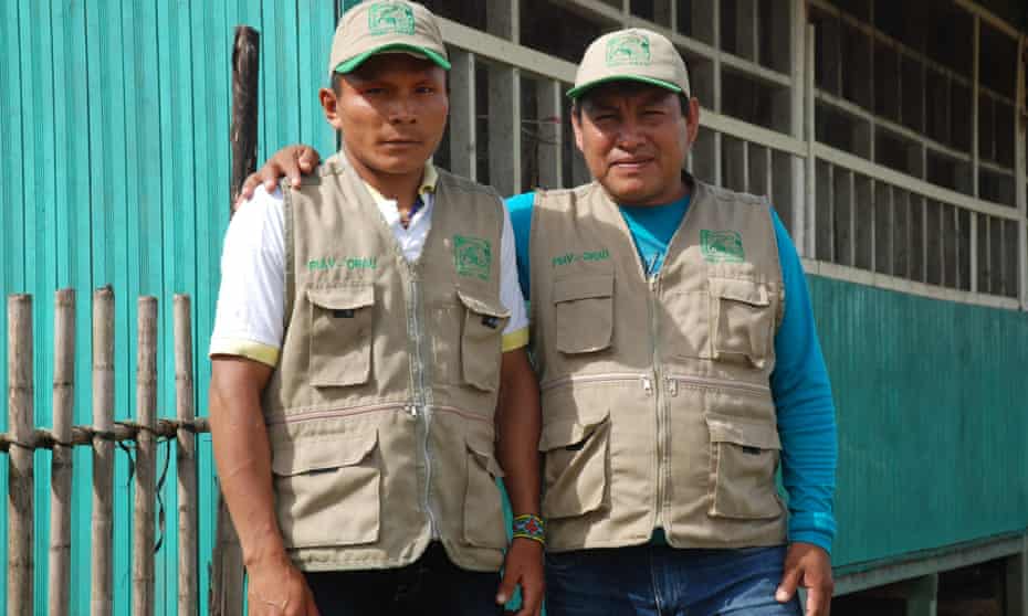 Ashéninka man Enoc Ruiz Santos and Shipibo man Pedro Monteluisa Romaina at a control post protecting a reserve for indigenous peoples living in "isolation" in the Peruvian Amazon.