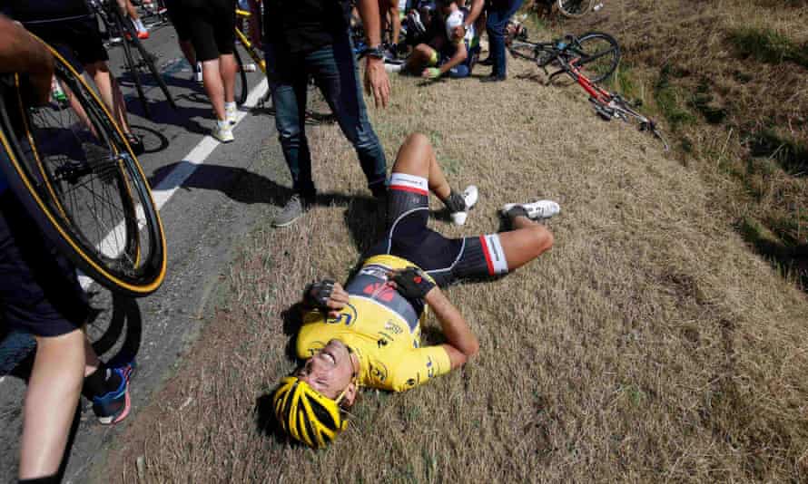 Race leader and yellow jersey holder Fabian Cancellara of Switzerland lies on the ground after a fall.