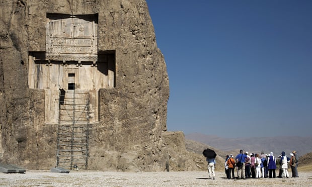 German tourists visit the tomb of Darius I the Great near Persepolis in Iran.