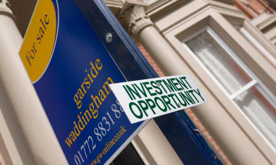 Estate agent and investment opportunity sign outside a house