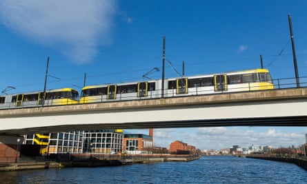 A tram crossing the Manchester Ship Canal on approach to Exchange Quay in Salford, Greater Manchester