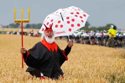 Dieter ‘Didi’ Senft, the self styled devil of the Tour de France, cheers on the riders during stage five , a 189.5km run between Arras and Amiens.