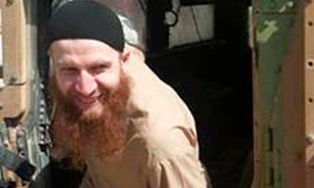 Omar al-Shishani climbing out of a humvee, in an image from the militant's social media.