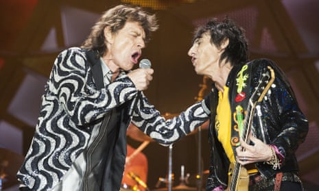 Mick Jagger, left, and Ronnie Wood go hard in Detroit.