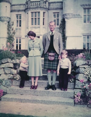 Philip and Elizabeth stand with Princess Anne and Prince Charles outside Balmoral Castle, September 1952.