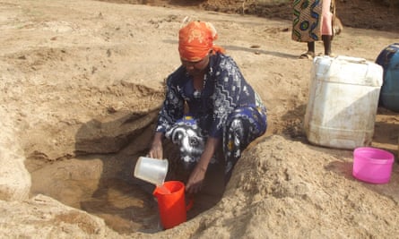 woman sand dam kenya