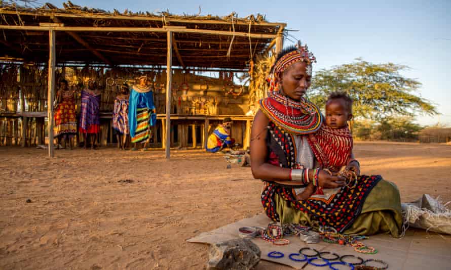 Craft work: China Laprodati with her baby selling her jewellery.