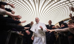 Pope Francis greets pilgrims at the Vatican.