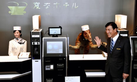 Huis Ten Bosch President Hideo Sawada with robot 'staff' at the Henn-na Hotel.
