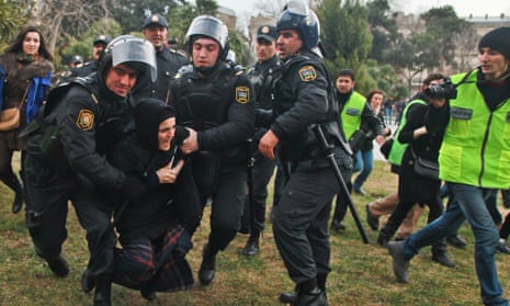 Azerbaijan police arrest demonstrators at an anti-government protest in 2013.