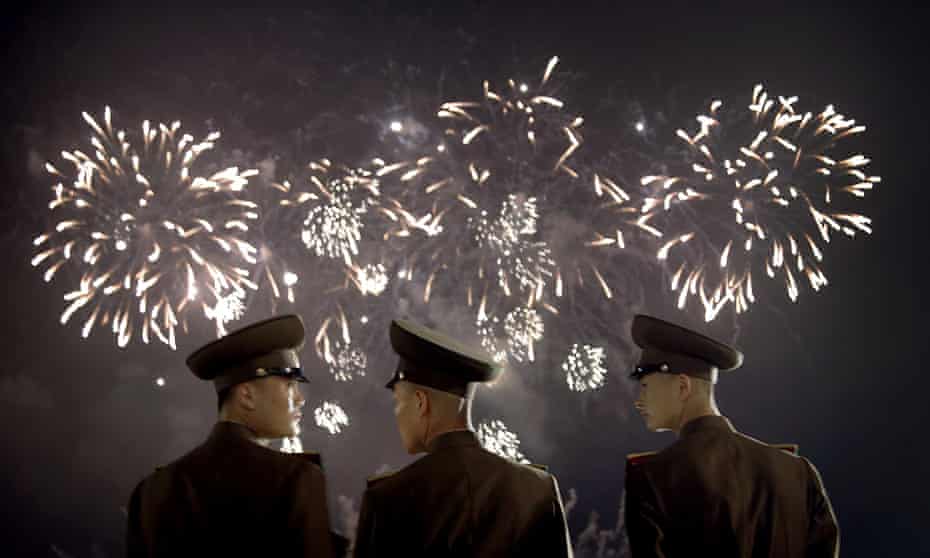 North Korean soldiers watch a fireworks display in Pyongyang.