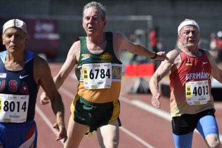 US athlete Dick Richards, left, South Africa's Ronald Cross and Germany's Karl-Heinz Neumann compete in the men's 100m final for 80-year-olds.