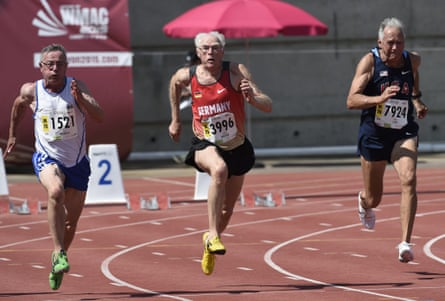 From left: Finland's Aimo Mikkola, Germany's Guido Muller (C) and the US's Robert Lida run the men's 75-years-old 100m final.