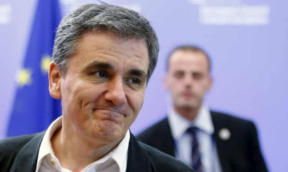 Greek Finance Minister Euclid Tsakalotos leaves a euro zone finance ministers meeting in Brussels, Belgium