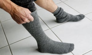 Man pulling up his socks