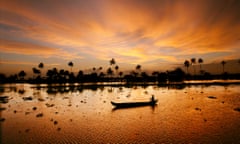 A canoe at dusk in the 'Backwaters' near Allepey in the Kerala region of India.