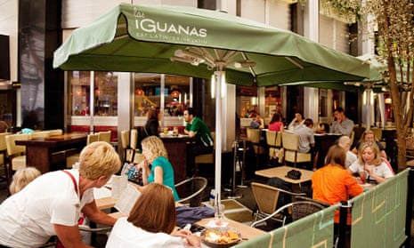 people eating a meal at Las Iguanas latin food restaurant, O2 arena, London UK