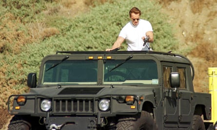 Arnold Schwarzenegger with his Humvee on Malibu beach in 1999.