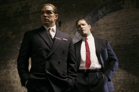 Tom Hardy as Ronnie (with spectacles) and Reggie Kray in Legend.