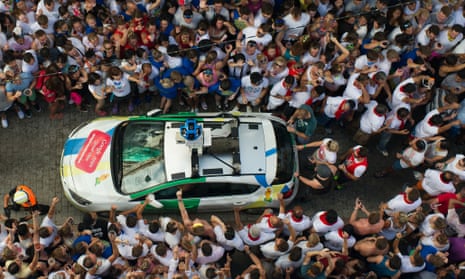 The Google Street View car drives through revellers shortly before it is pelted with tomatoes.