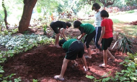 School girls in Mumbai creating a bed to grow vegetables