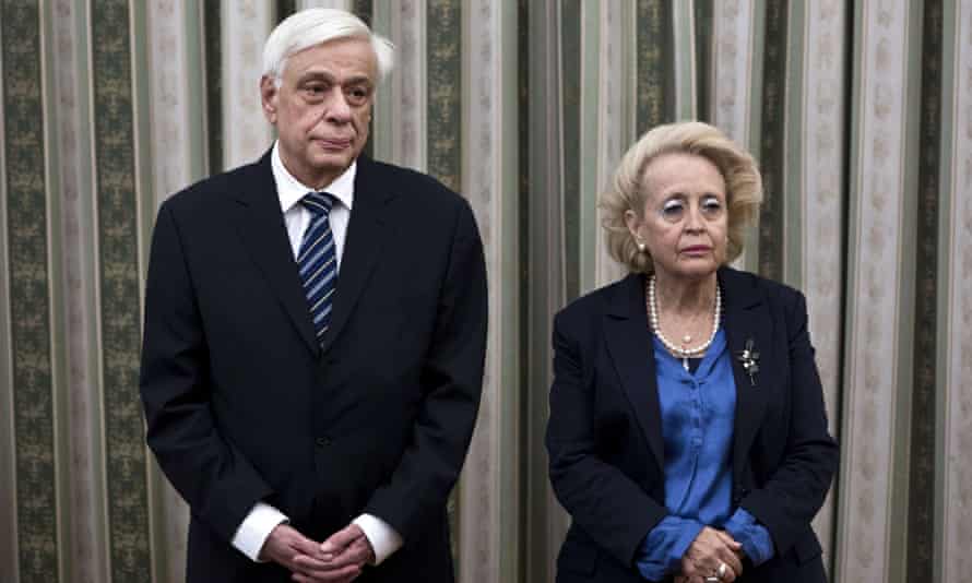 Appointed caretaker Greek Prime minister Vasiliki Thanou (R), attends with Greek President, Prokopis Pavlopoulos a swearing-in ceremony of the newly appointed members of the government at the presidential palace in Athens on Friday.