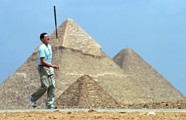 Dedication's what you need ... record-breaking record breaker Ashrita Furman walked 11.3 km (7 miles) balancing a billiard cue on the tip of his finger.