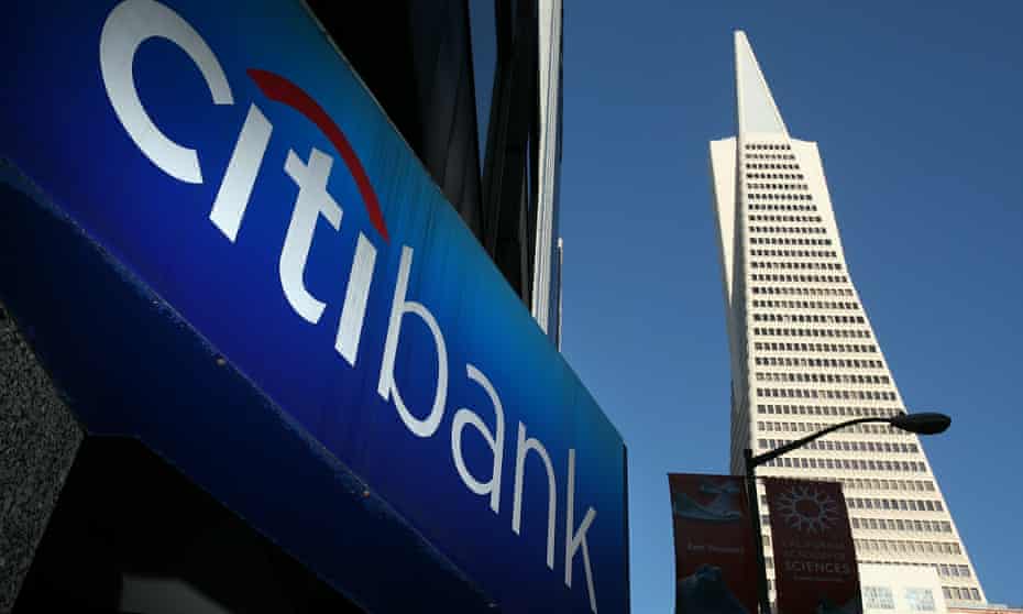 A sign is displayed on the exterior of a Citibank branch office in San Francisco, California.  A division of Citibank has published a report finding that slowing global warming would produce a positive return on investment.