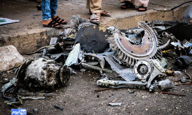 A photo provided by the Syrian anti-government activist group Ariha Today shows parts of a destroyed government warplane that crashed in  Ariha.