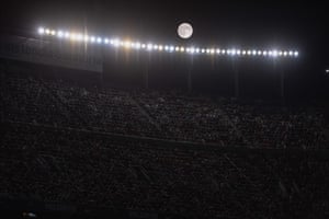 The moon shines during the Spanish league football match FC Barcelona vs Malaga CF at the Camp Nou stadium in Barcelona, Spain