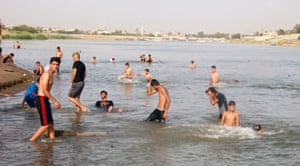 Iraqis cool themselves in the Tigris river in Baghdad, with temperatures reaching around 45 degrees Celsius. A searing heat wave forecast to sweep through Iraq prompted the government to declare a four-day holiday and order regular power cuts at state institutions.