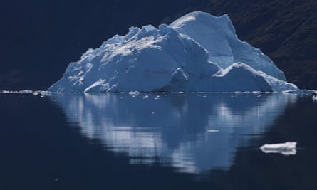 ILULISSAT, GREENLAND - JULY 21:  An iceberg floats through the water on July 21, 2013 in Ilulissat, Greenland. As the sea levels around the globe rise, researchers affiliated with the National Science Foundation and other organisations are studying the phenomena of the melting glaciers and its long-term ramifications. The warmer temperatures that have had an effect on the glaciers in Greenland also have altered the ways in which the local populace farm, fish, hunt and even travel across land.