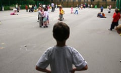 A boy with his back to the camera