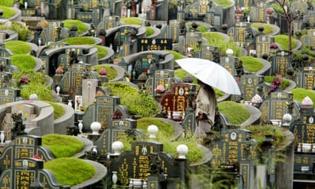 A man walks through the Choa Chu Kang cemetery. As more graves are exhumed, the Chinese custom of ancestor worship at grave sites is fading in Singapore.