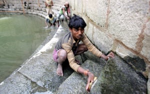 Workers carry out conservation work at Hazrat Nizamuddin Auliyas baoli in New Delhi.