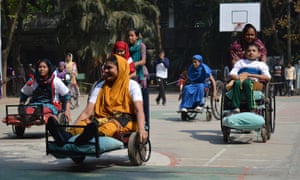 Wheelchair basketball players leave the court at a quarterly Sports Day for patients at the Centre for the Rehabilitation of the Paralysed, Bangladesh. 