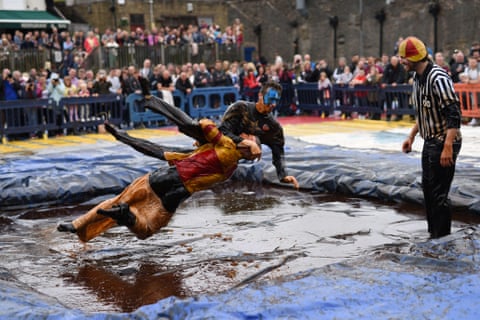 Competitors take part in the 8th annual World Gravy Wrestling Championships at the Rose ‘N’ Bowl Pub in Stacksteads, Lancashire. Contestants must participate in fancy dress and wrestle in a pool of “Lancashire Gravy” for 2 minutes while being scored for a variety of wrestling moves.