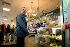 President Barack Obama points to a pastry display at the Snow City Cafe in Anchorage, Alaska