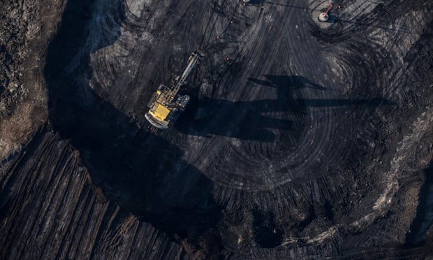 Trucks and machinery along routes within the Suncore tar sands site near Fort McMurray in northern Alberta.