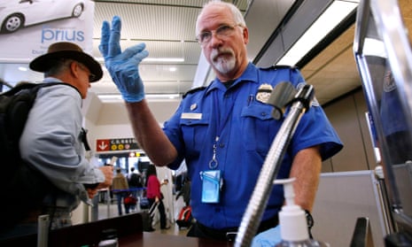 A TSA officer at a security checkpoint in Seattle-Tacoma International airport. All passengers’ baggage locks must be branded ‘travel sentry approved’ in the US. 