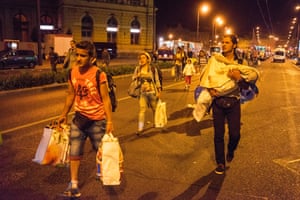 Refugees board buses that will finally take them to Austria after days of being stranded. The Hungarian government chartered dozens of buses to take the refugees away in the middle of the night. It took under 3 hours to empty the station of almost all its refugees.