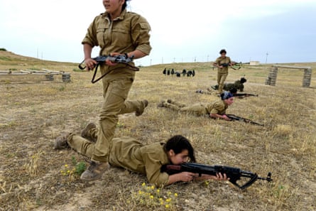 Yazidi girls take part in a military training session organised by the Kurdish Women’s Protection Unit (YPJ) in the Sinjar region of Iraq. All photographs by Alfred Yaghobzadeh.