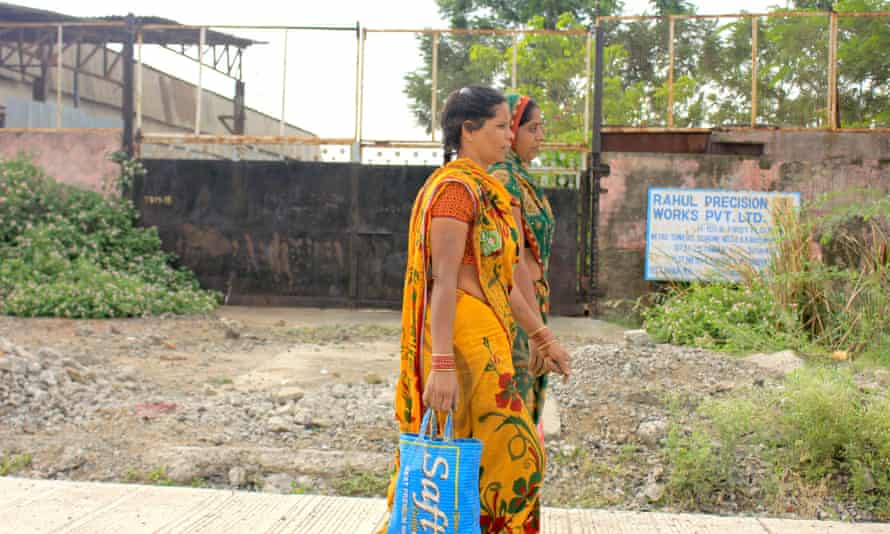 Women head to work in the assembly unit of a factory in  Pithampur.