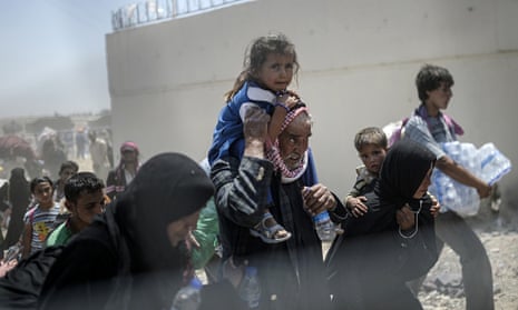 TOPSHOTS Syrians fleeing the war walk to