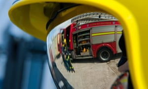 Fireman in helmet with reflective visor down